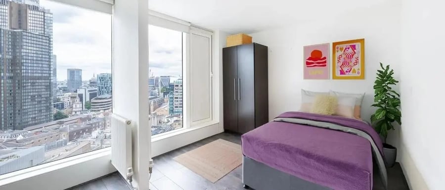 Bed wardrobe artwork plant Bedroom at Chapter Spitalfields in London Student Accommodation