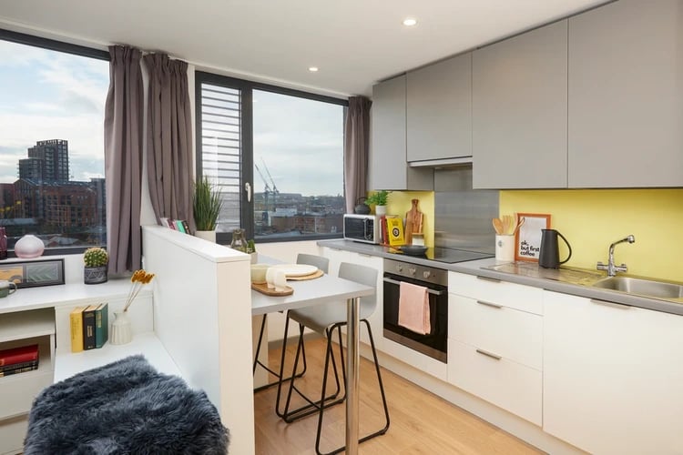 Compact kitchen island with seating kitchen and living area at Staniforth House in Birmingham Student Accommodation