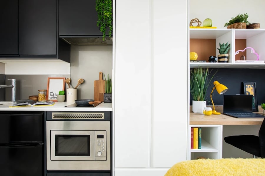 Kitchen microwave and study area with laptop Image Type at Walmsley Studios in London Student Accommodation