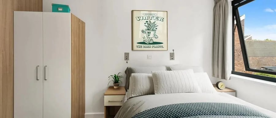 Wardrobe bed bedside table poster Bedroom at Chapter Islington in London Student Accommodation