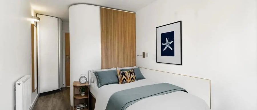 Bed nightstand art radiator in bedroom Bedroom at Chapter Islington in London Student Accommodation