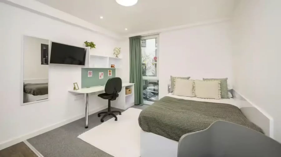 Bed desk mirror TV and shelving bedroom at The Glassworks Leicester in Leicester Student Accommodation