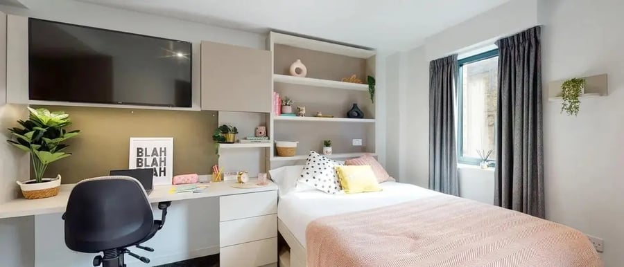 Desk bed shelves TV plants bedroom at Chapter Westminster in London Student Accommodation