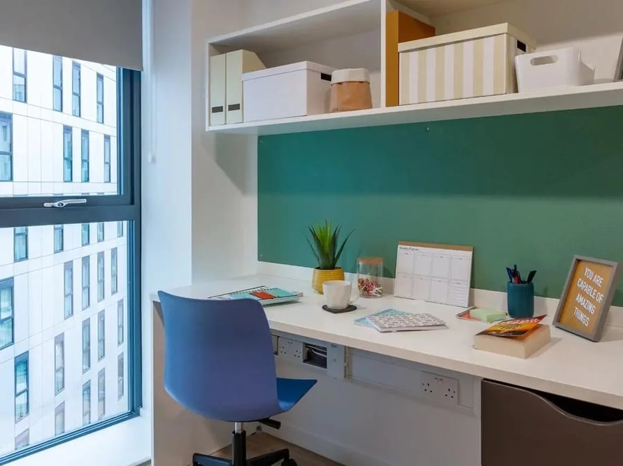 Desk with chair plant and planner Study area at Pavilion Court London in London Student Accommodation
