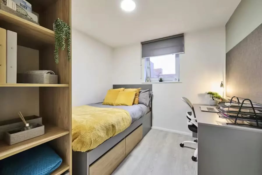Bed desk and shelves student bedroom at Queens Court Leicester in Leicester Student Accommodation
