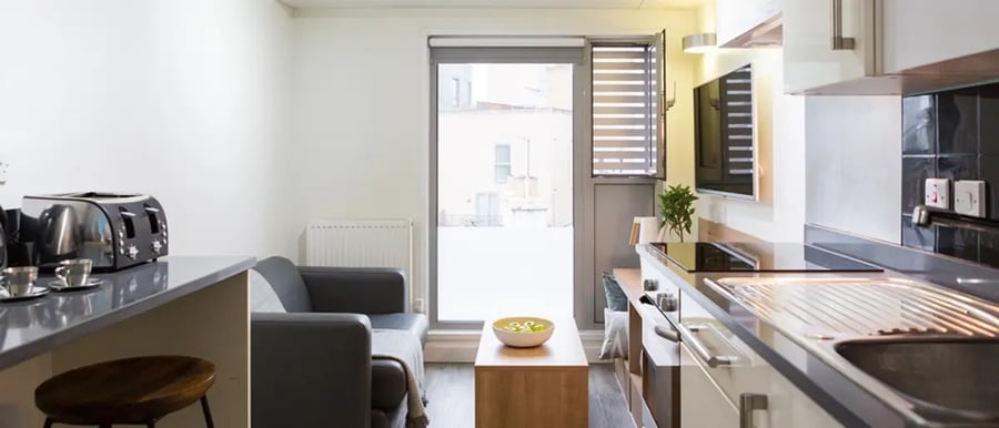 Kitchen with sofa and toaster living area at Chapter South Bank in London Student Accommodation