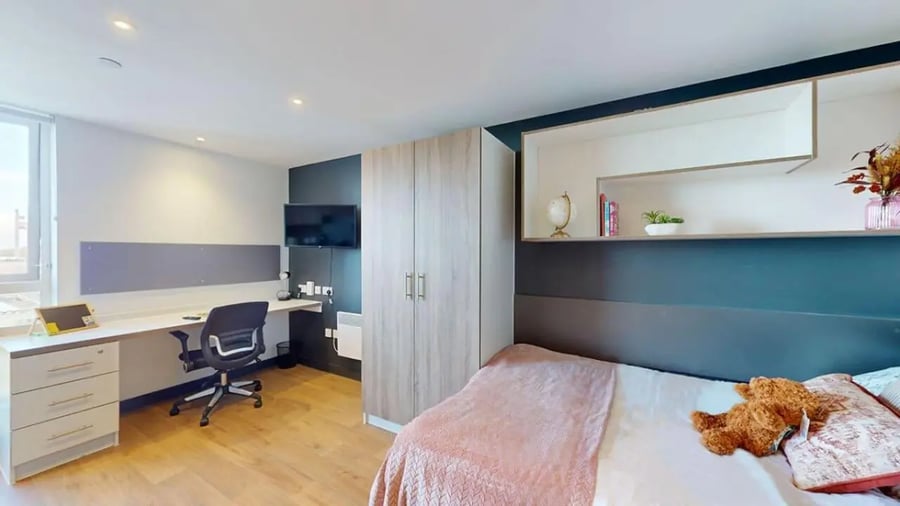 Desk bed wardrobe and tv student studio bedroom at Innovo House in Liverpool Student Accommodation