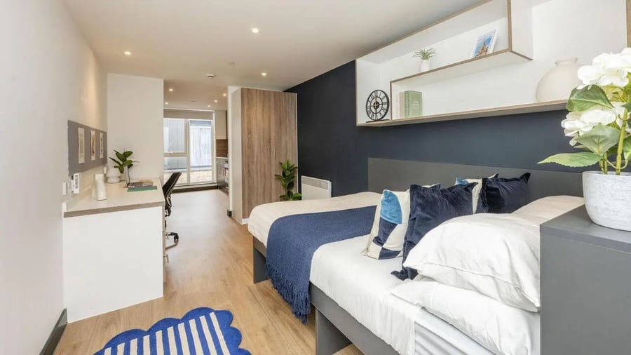 Bed desk wardrobe and rug bedroom at Innovo House in Liverpool Student Accommodation
