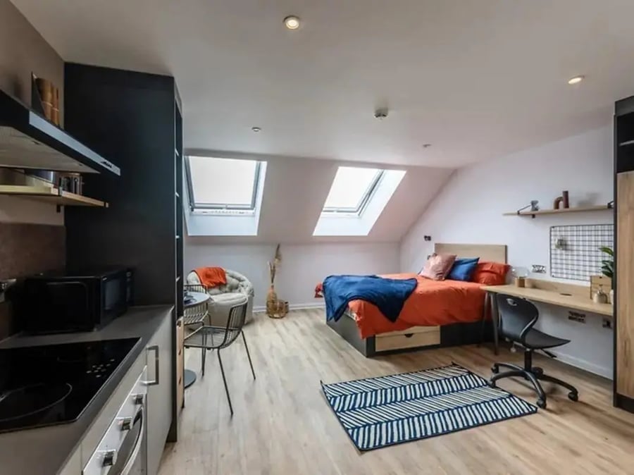 Studio apartment with bed desk kitchen area and seating. at Murieston Crescent - Edinburgh in Edinburgh Student Accommodation