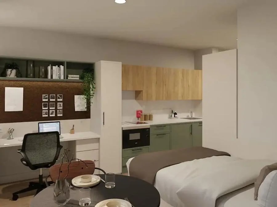 Desk chair laptop kitchen and bed studio at Yugo Haüs in Birmingham Student Accommodation