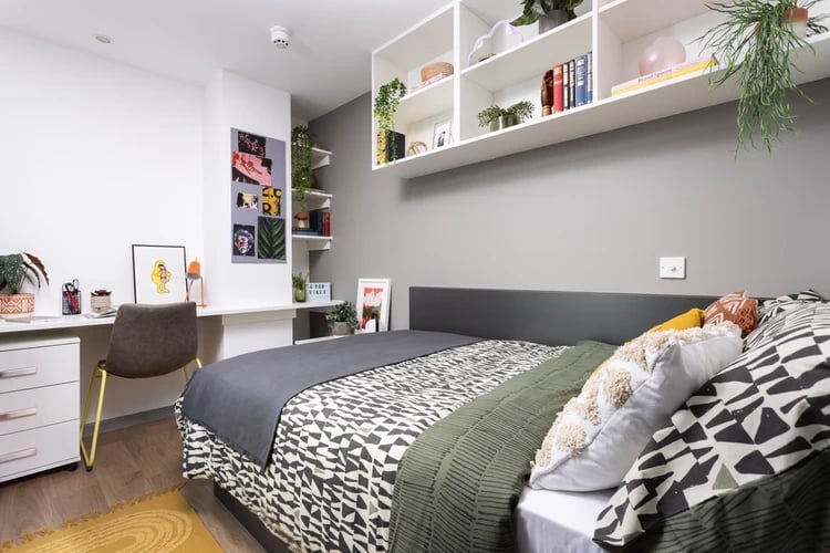 Bed desk chair shelves photos books Bedroom at Hayloft Point in London Student Accommodation