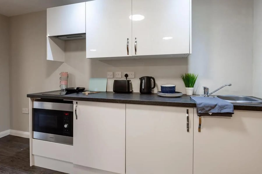 Microwave kettle toaster dishes sink kitchen at One Islington Plaza in Liverpool Student Accommodation
