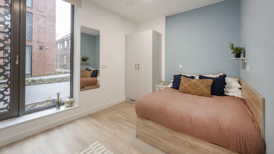 Bed wardrobe mirror window bedroom at St Gabriels in Manchester Student Accommodation