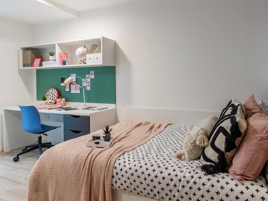 Bed desk blue chair globe shelves bedroom at Pavilion Court London in London Student Accommodation