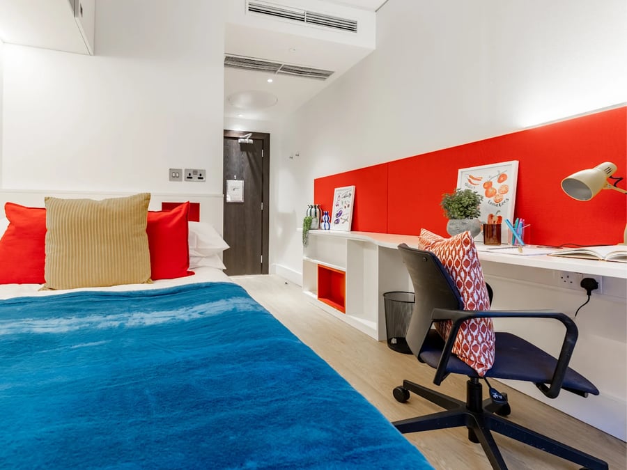 Bed desk and chair in student room at Spring Mews in London Student Accommodation