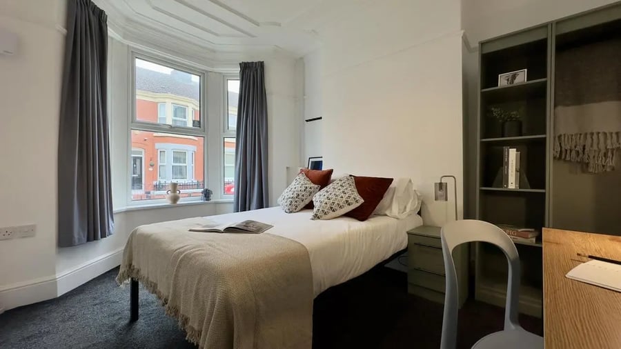 Bed pillows shelf and desk bedroom at 4 Bedroom House at 126, Empress Road in Liverpool Student Accommodation