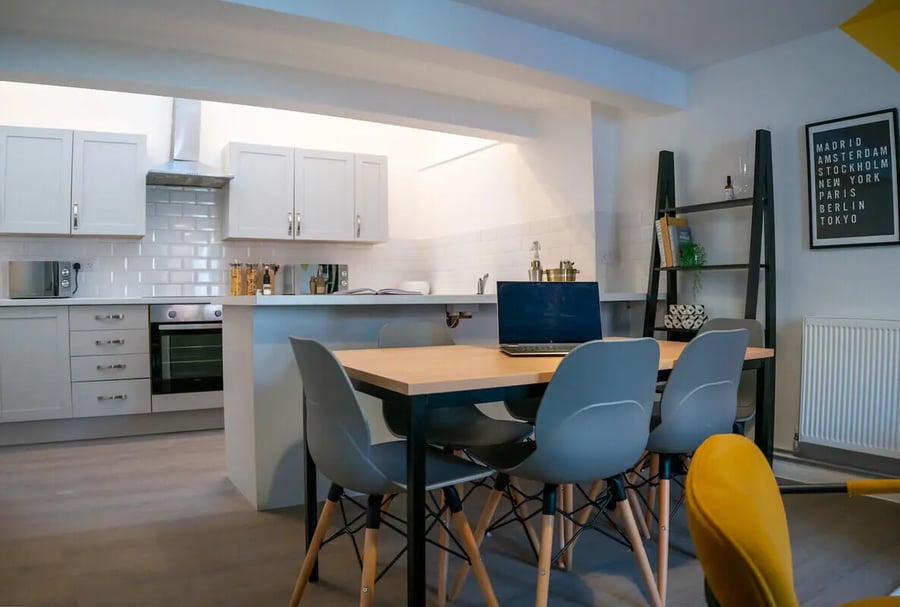 Table chairs laptop kitchen area at 6 Bedroom House at 64A, Monson Street in Lincoln Student Accommodation