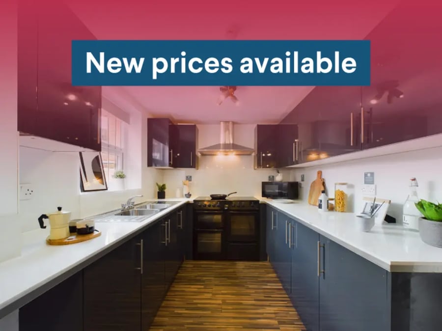 Modern u-shaped kitchen with dark cabinets and appliances kitchen at 6 Bedroom House at 31, Deramore Street in Manchester Student Accommodation