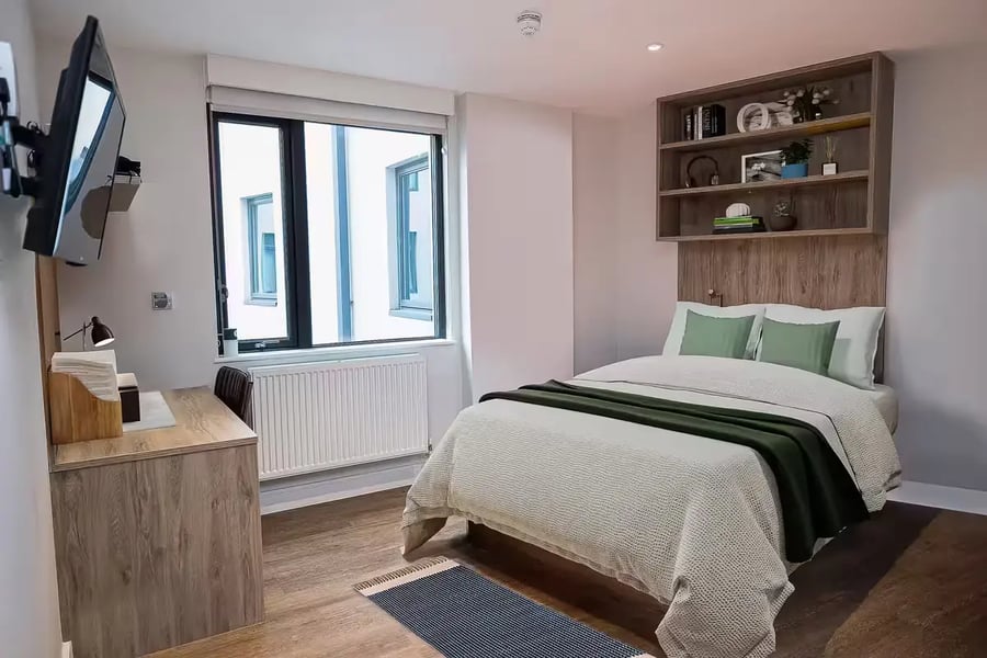 Bed desk TV shelves and window Bedroom at Canvas Student - Quintana Gate in Exeter Student Accommodation