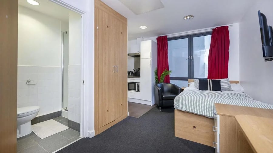 Bedroom with kitchenette study area and bathroom at The Apollo Works in Coventry Student Accommodation