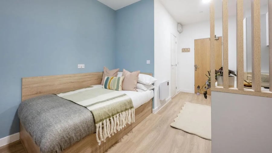 Bed with pillows and blankets bedroom at St Gabriels in Manchester Student Accommodation