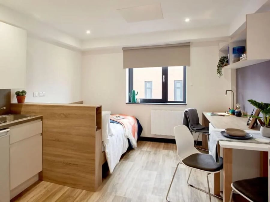 Bed desk and kitchenette studio apartment at Eden Square in Coventry Student Accommodation