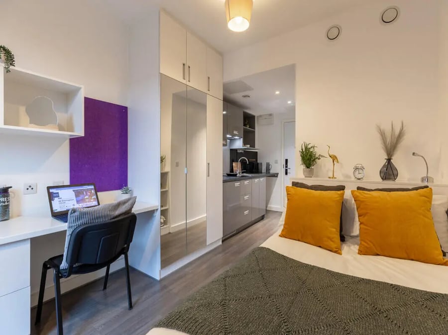 Desk laptop chair purple board bed kitchen living room at 88 Bromsgrove House in Birmingham Student Accommodation