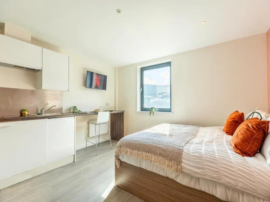 Bed kitchen and desk area studio apartment at Gallery Apartments in Glasgow Student Accommodation