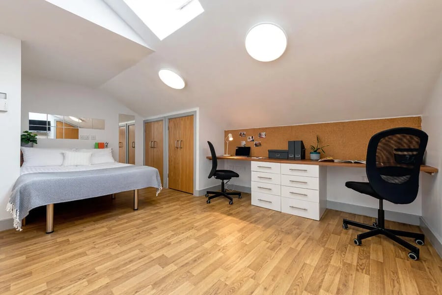 Bed desk chairs cabinets closet study area at Collegiate St James Street in Portsmouth Student Accommodation