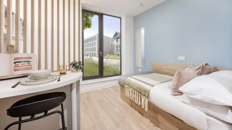 Bed white bedding desk and chair bedroom at St Gabriels in Manchester Student Accommodation