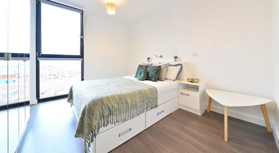 Bed with storage nightstand triangular table bedroom at 88 Bromsgrove House in Birmingham Student Accommodation