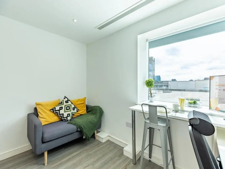 Sofa bar table and stool student accommodation living room at Redvers Tower in Sheffield Student Accommodation