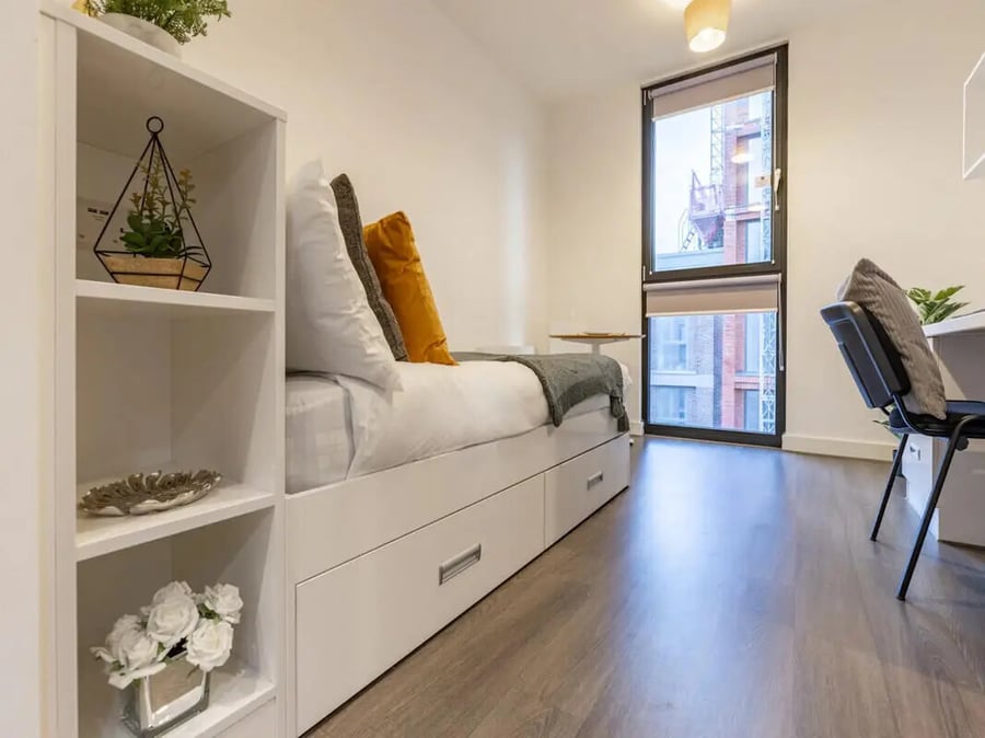Bed with pillows shelves and window bedroom at 88 Bromsgrove House in Birmingham Student Accommodation