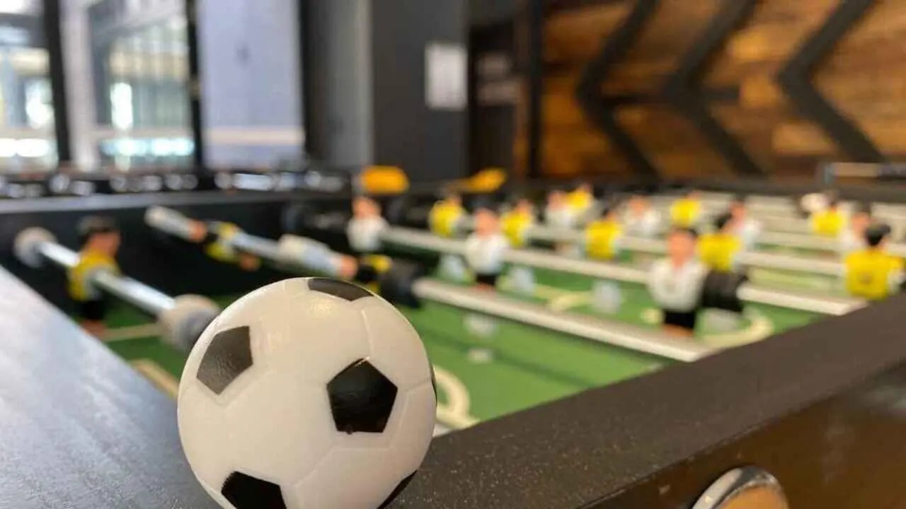Foosball table with players and ball common area at UniLodge Ultimo in Sydney Student Accommodation