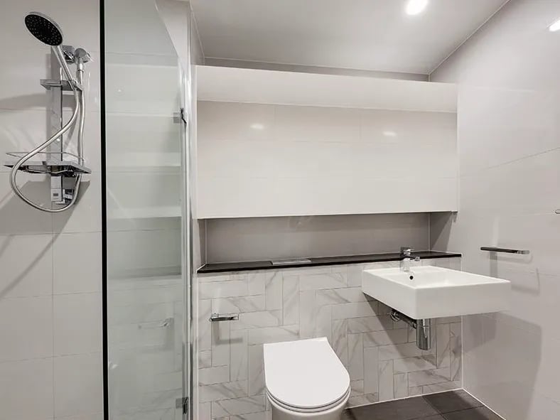 Shower toilet sink modern bathroom at Belong Mascot in Sydney Student Accommodation