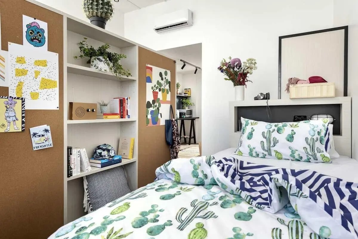 Cactus bedding and wall art bedroom at Campus Perth in Perth Student Accommodation