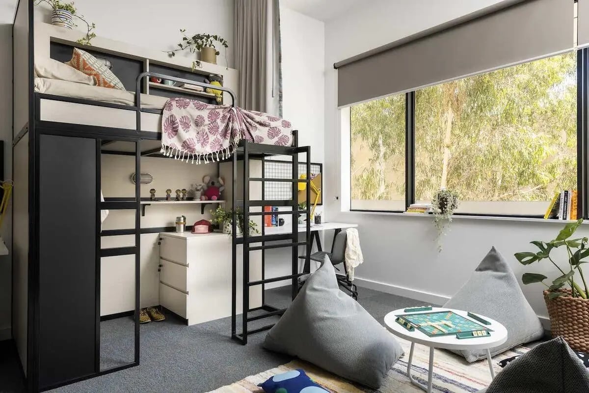 Loft bed desk beanbags and board game living room at Campus Perth in Perth Student Accommodation