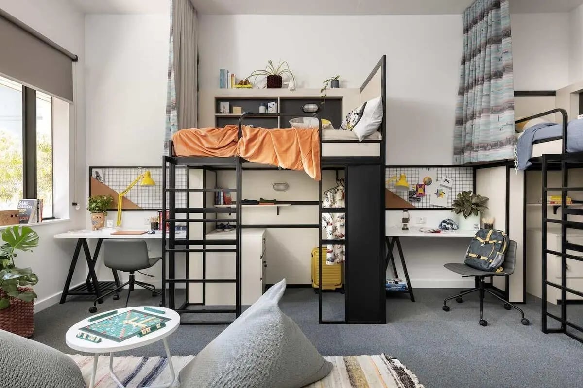 Bunk beds desks chairs beanbags and game table bedroom at Campus Perth in Perth Student Accommodation