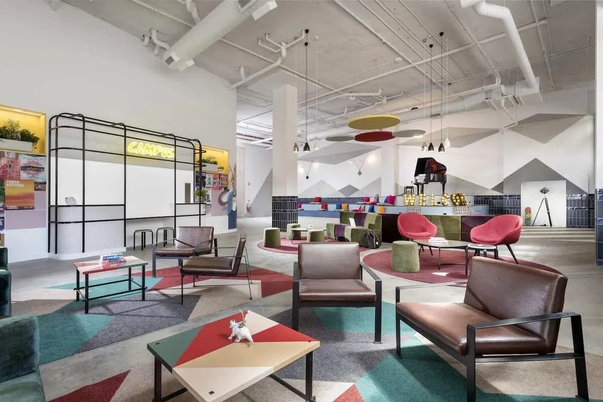 Modern lounge with piano and colorful seating living room at Campus Perth in Perth Student Accommodation