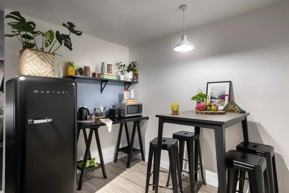 Retro fridge microwave and stools kitchen at Campus Perth in Perth Student Accommodation