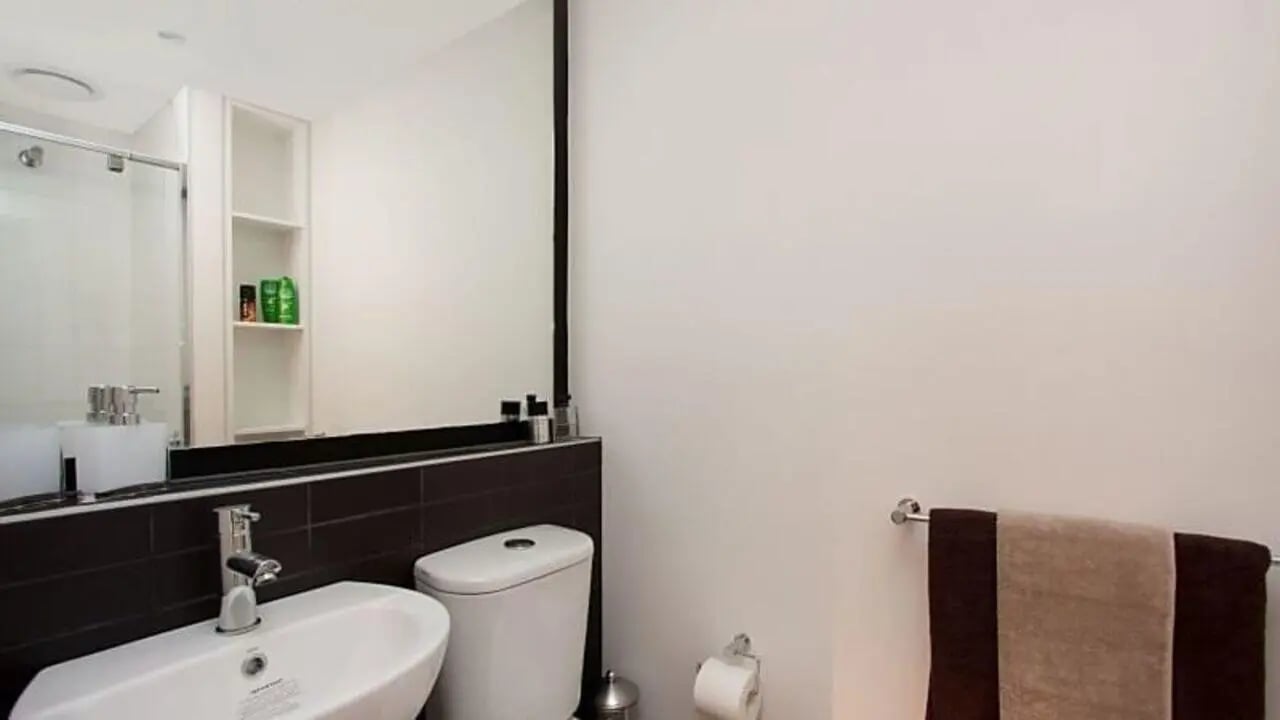 Sink toilet shower and towels bathroom at Student Living on Villiers in Melbourne Student Accommodation
