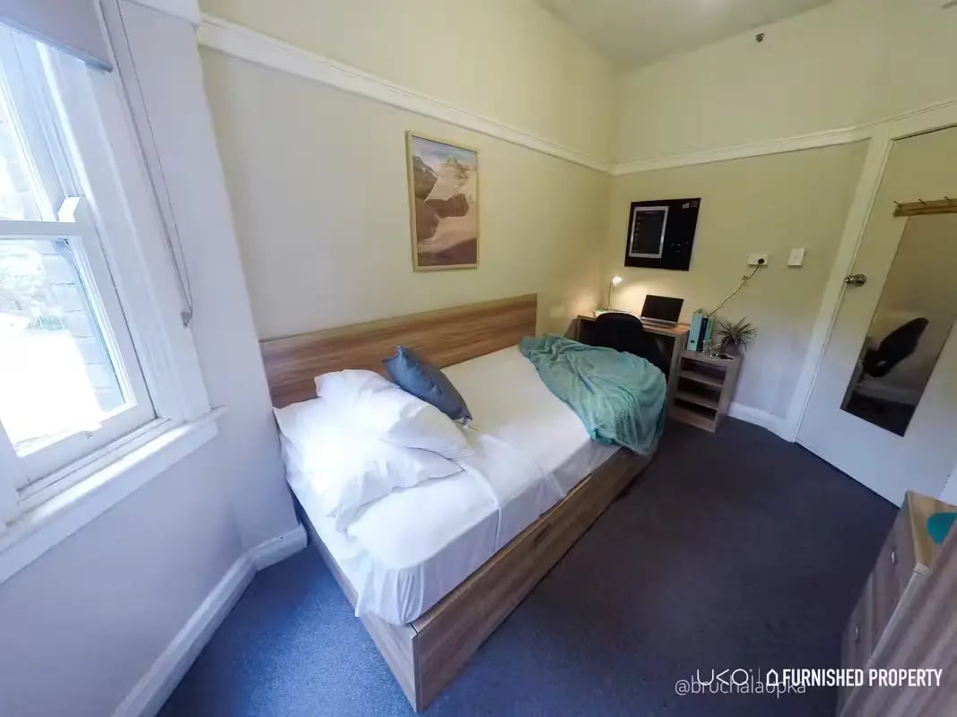 Bed desk laptop and mirror bedroom at ume Potts Point in Sydney Student Accommodation