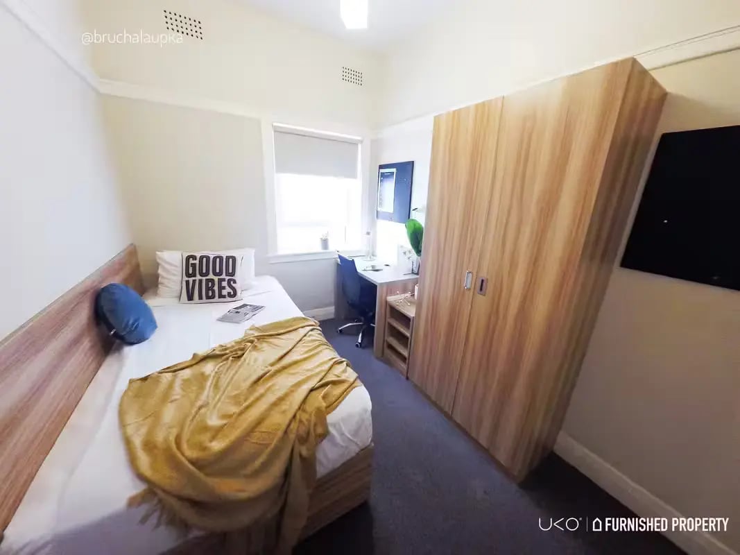 Bed study desk wardrobe and window bedroom at ume Potts Point in Sydney Student Accommodation