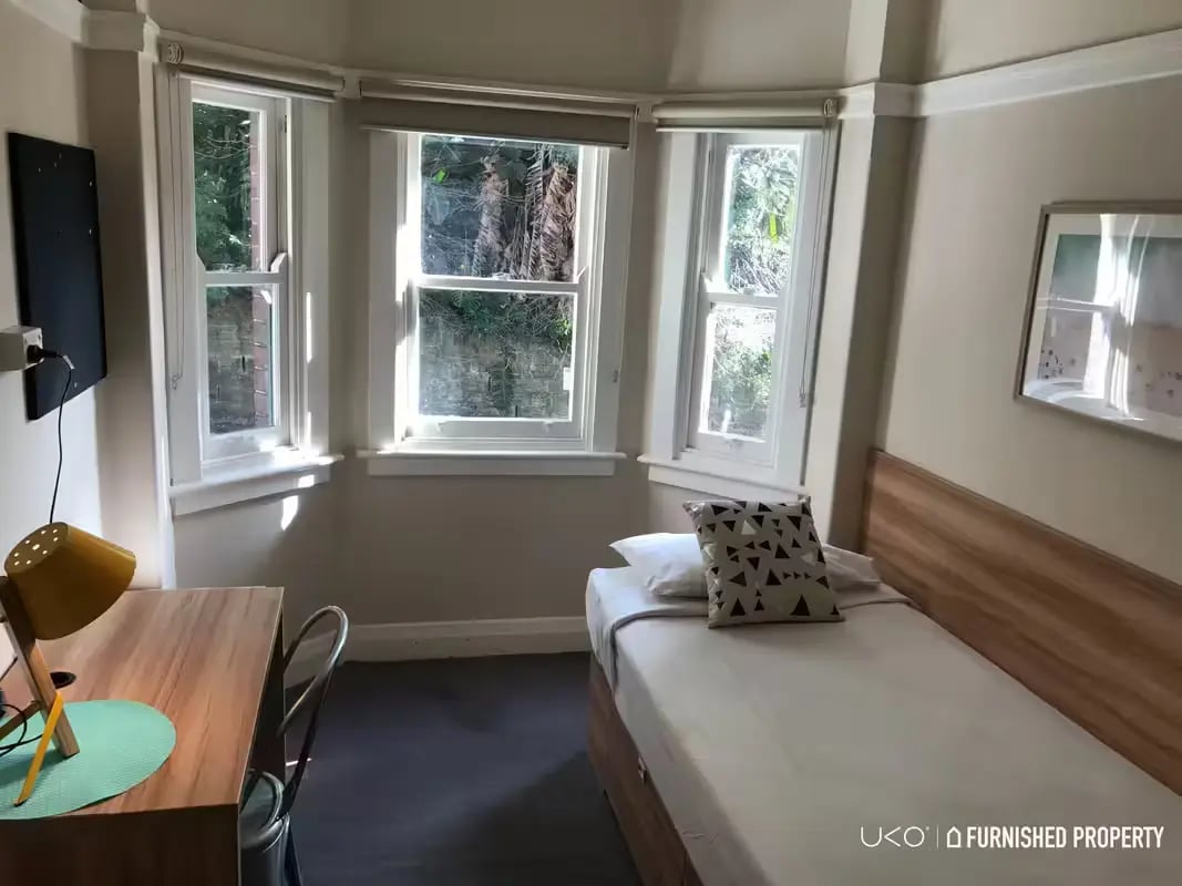 Bed desk lamp and television bedroom at ume Potts Point in Sydney Student Accommodation