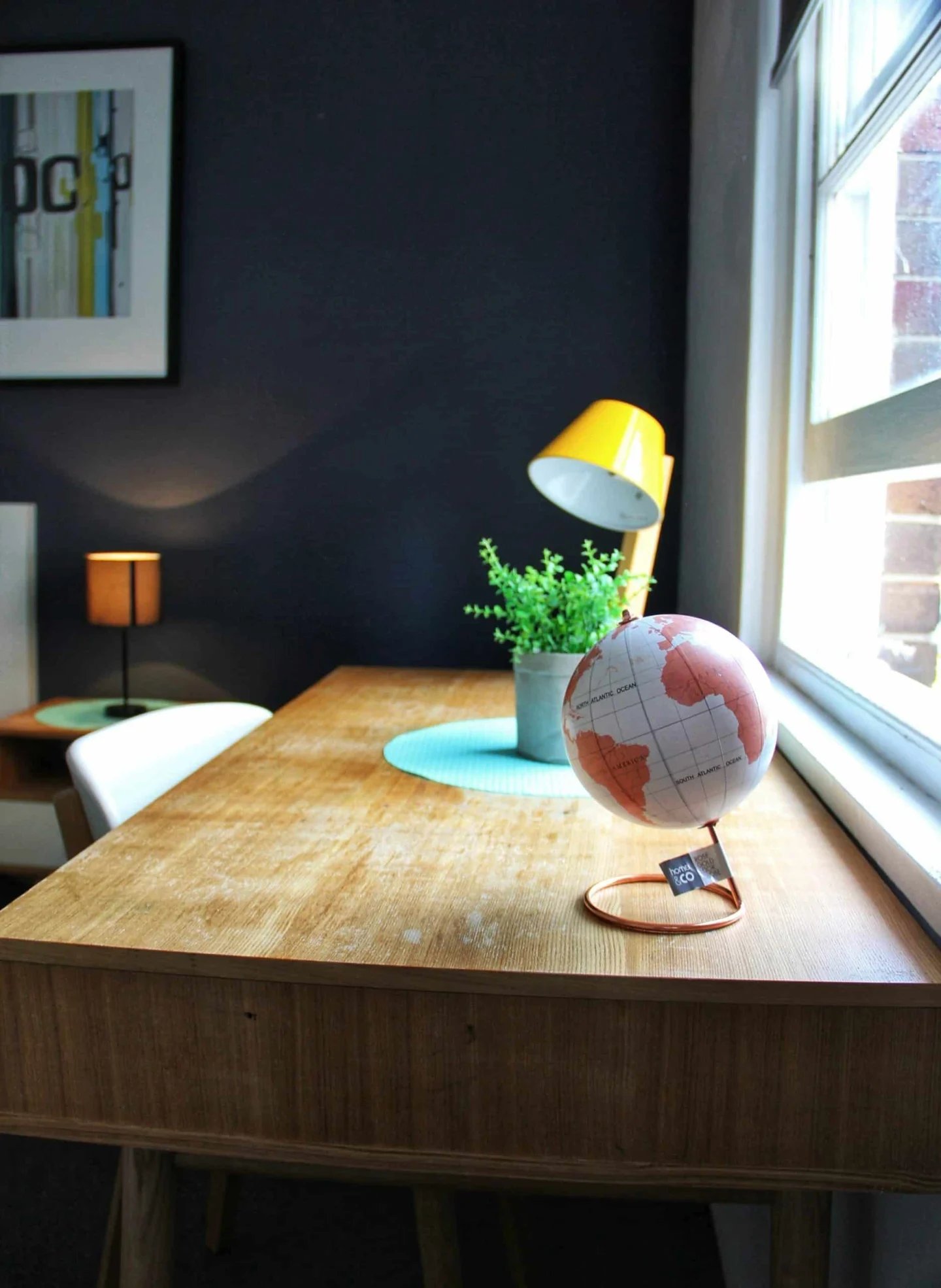 Desk with globe plant and lamp study area at ume Hyde Park in Sydney Student Accommodation