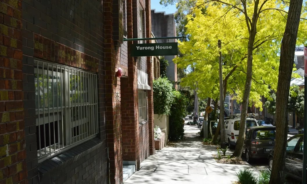 Yurong House sign brick building street cars exterior at ume Hyde Park in Sydney Student Accommodation