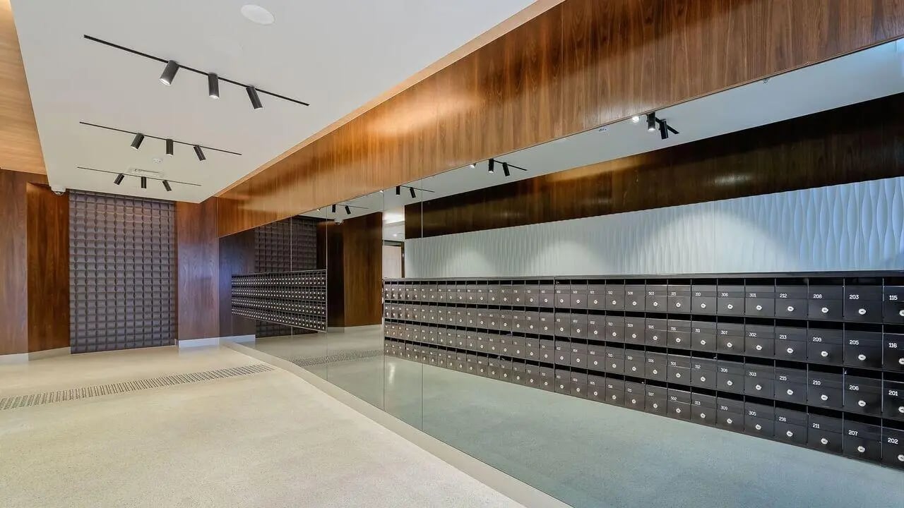 Mailboxes and textured wall entrance area at Student Living on Lonsdale in Melbourne Student Accommodation
