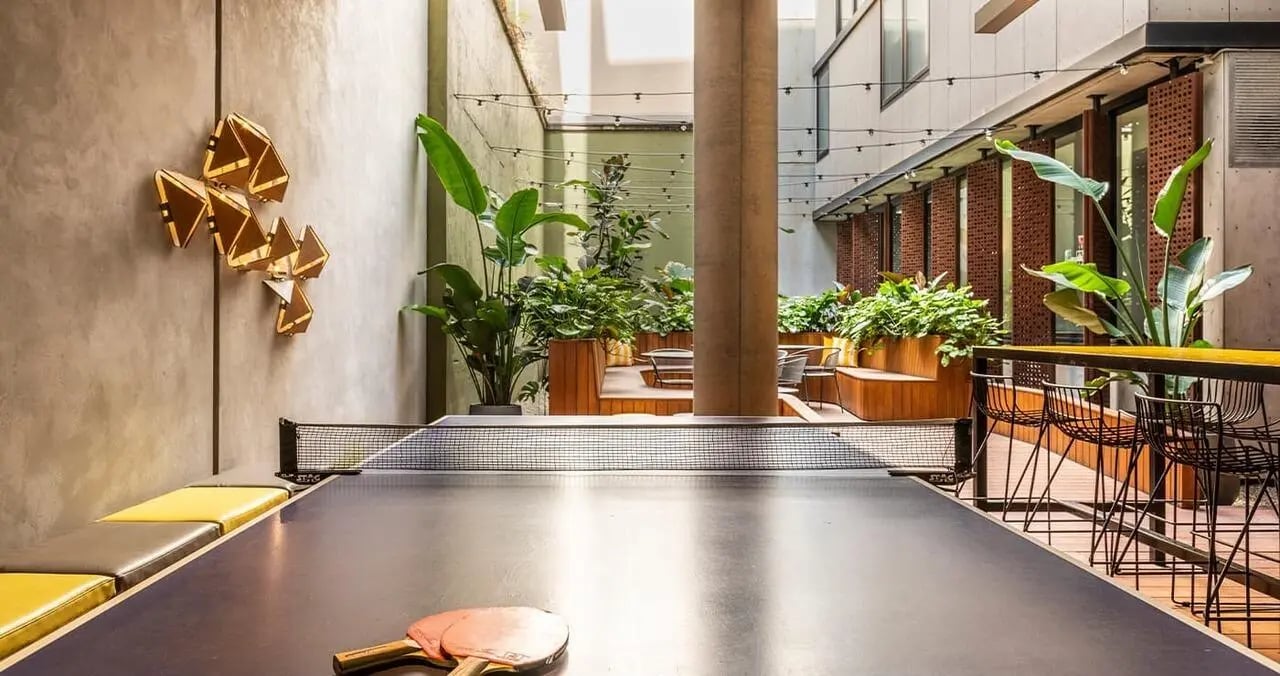 Ping pong table with paddles and bench playing area at Iglu Central in Sydney Student Accommodation