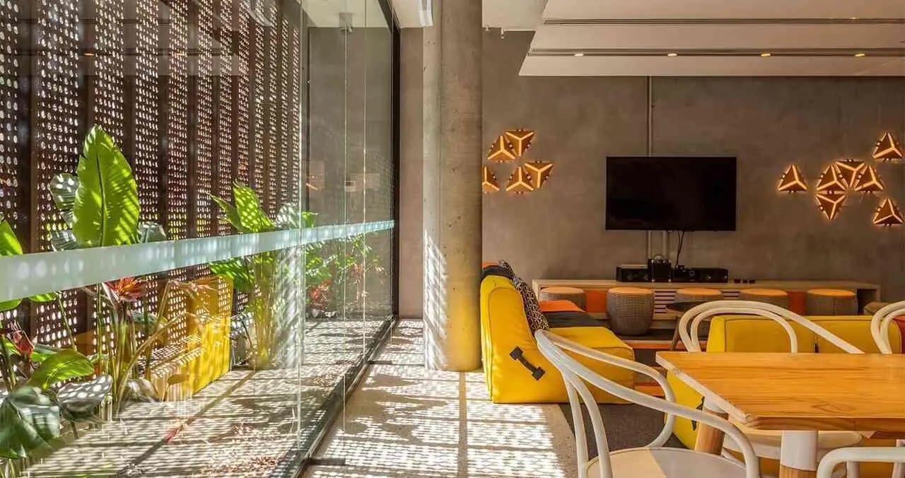 Yellow beanbag modern lights TV living room at Iglu Central in Sydney Student Accommodation