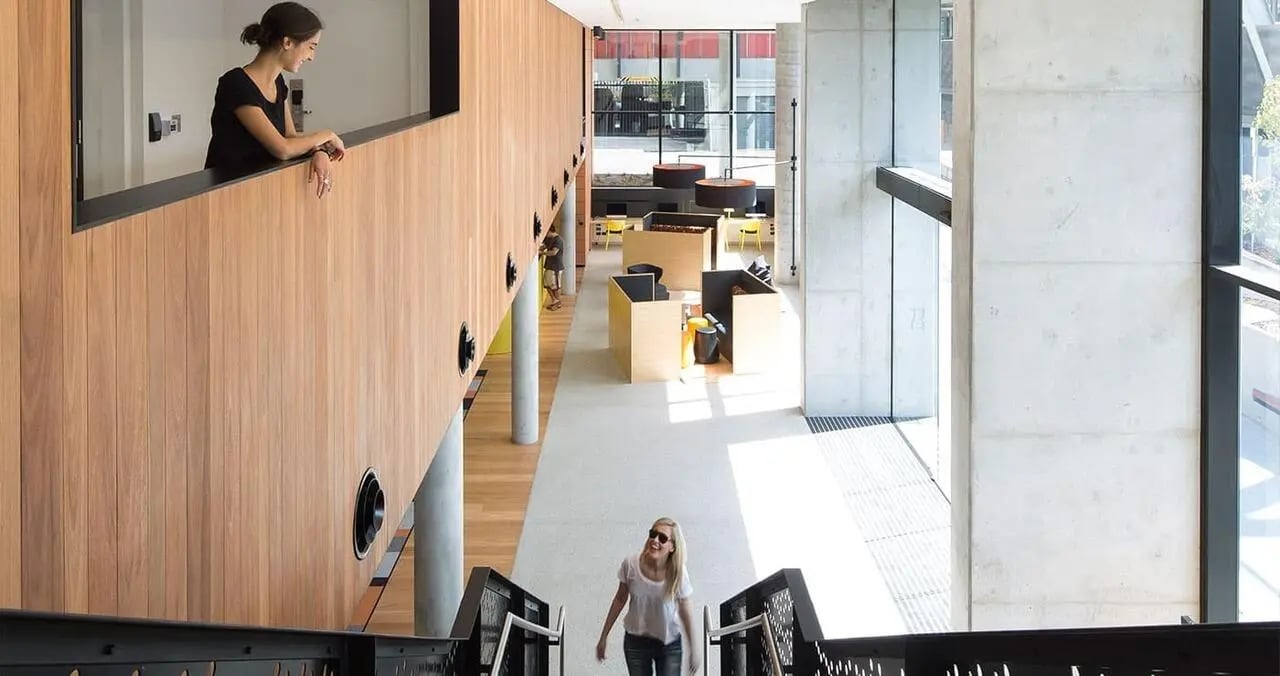 Students in a modern communal study area at Iglu Chatswood in Sydney Student Accommodation